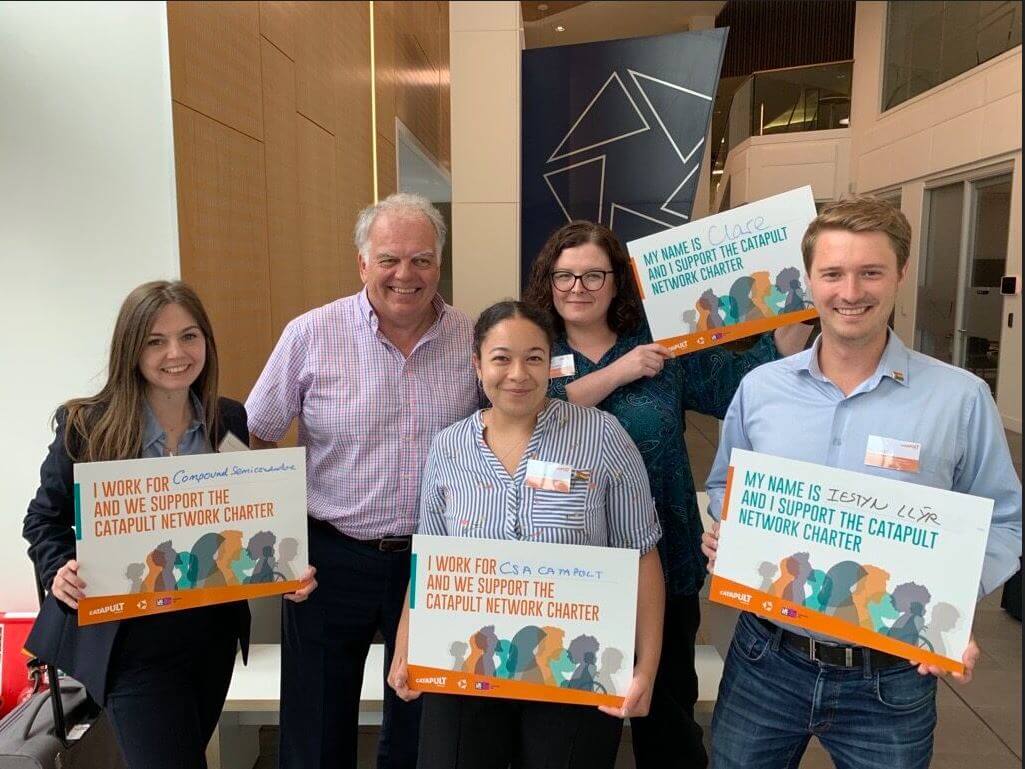 Catapult staff holding signage