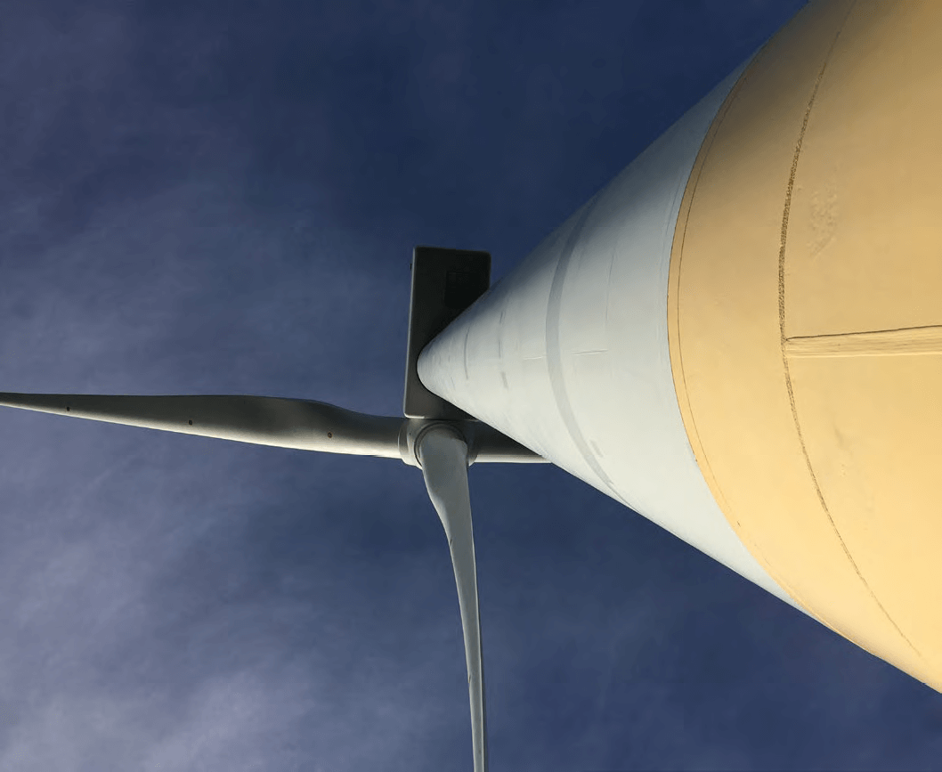 Looking upwards at a windturbine