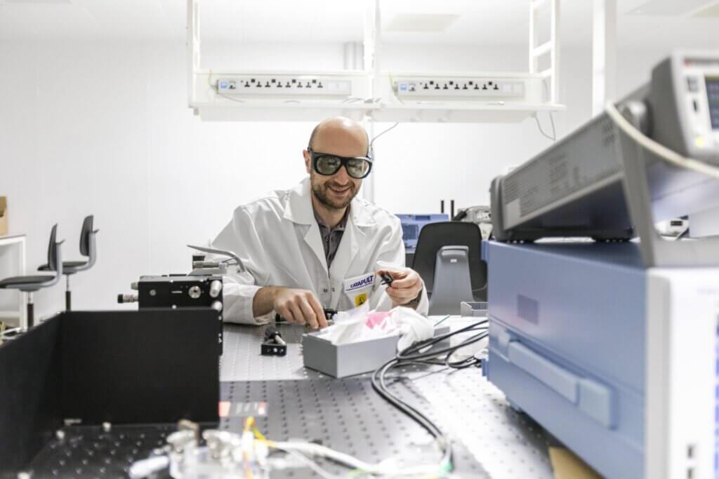 Man in goggles in a lab setting