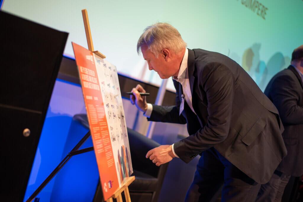 Stuart Martin signing an equality Charter