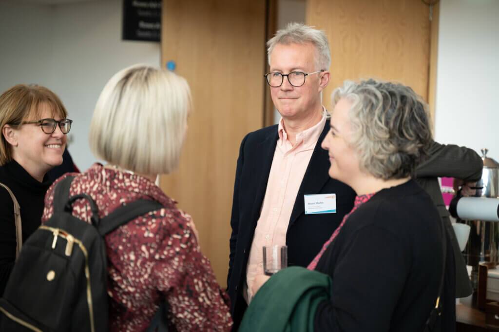 A group of people in conversation 