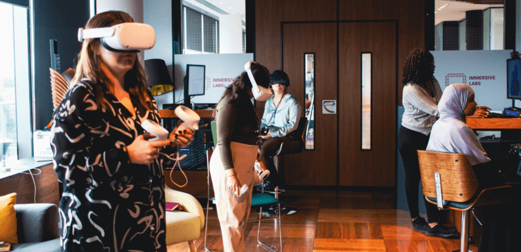 Women wearing immersive VR headsets 