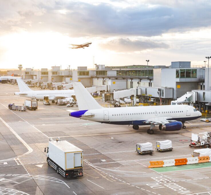 Planes parked at gates at an airport